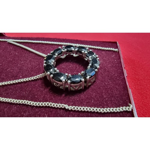 145 - 925 silver pendant inset with black tourmaline stones on a 16 inch 925 silver chain