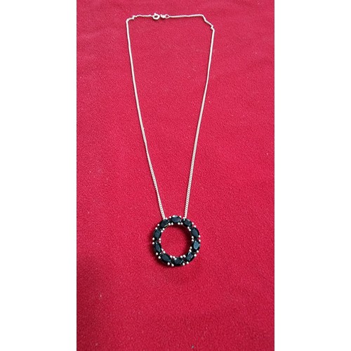 145 - 925 silver pendant inset with black tourmaline stones on a 16 inch 925 silver chain