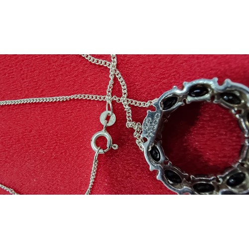 145 - 925 silver pendant inset with black tourmaline stones on a 16 inch 925 silver chain