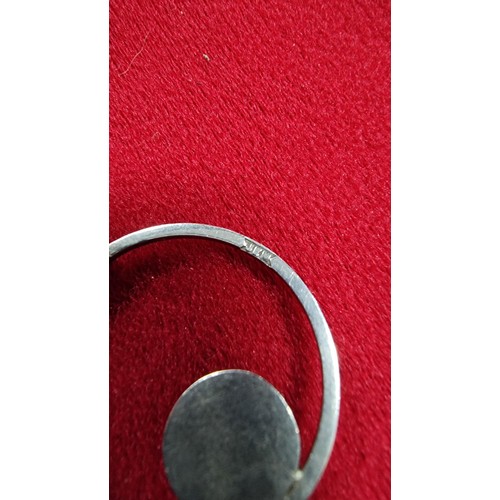 153 - White metal pendant and 16 inch chain with a black stone marked GEM