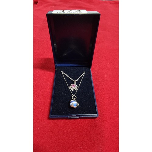 173 - Bundle of 2x 925 silver pendants both on a 18 inch 925 silver chains