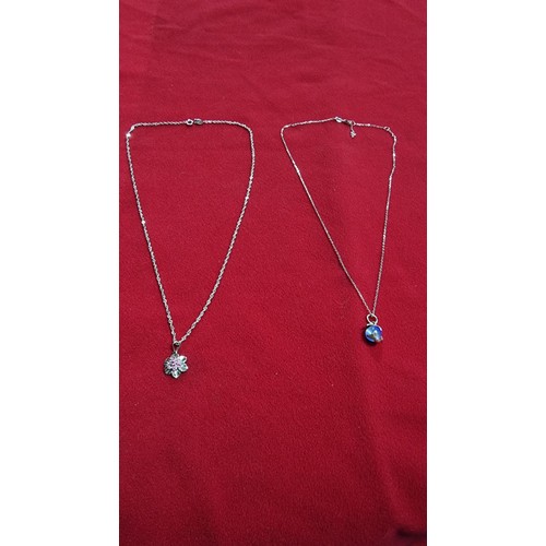 173 - Bundle of 2x 925 silver pendants both on a 18 inch 925 silver chains