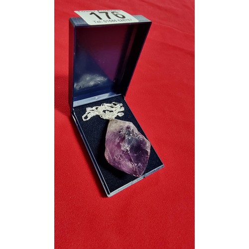 176 - Very large and chunky pointed Amethyst pendant presenting very good deep purple to white colours set... 