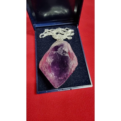 176 - Very large and chunky pointed Amethyst pendant presenting very good deep purple to white colours set... 