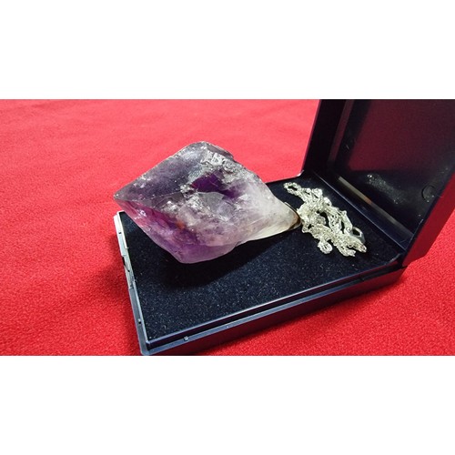 176 - Very large and chunky pointed Amethyst pendant presenting very good deep purple to white colours set... 