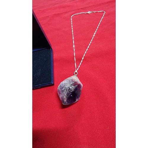 176 - Very large and chunky pointed Amethyst pendant presenting very good deep purple to white colours set... 