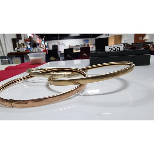 299 - 9ct. tri colour gold three piece bangle with white rose and yellow golds unmarked but tests as 9ct. ... 