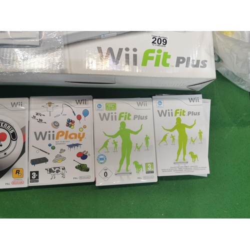 209 - Chest containing a Wii Fit Plus board, Wii console, collection of games and accessories etc