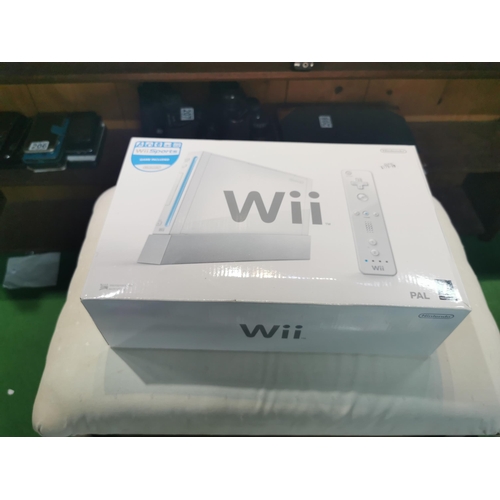 209 - Chest containing a Wii Fit Plus board, Wii console, collection of games and accessories etc