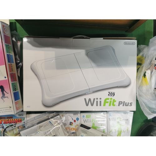 209 - Chest containing a Wii Fit Plus board, Wii console, collection of games and accessories etc