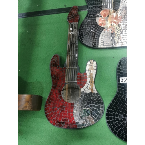 235 - 3 guitar shaped mirror's with a mosiac design. Tallest guitar measures 103cm.