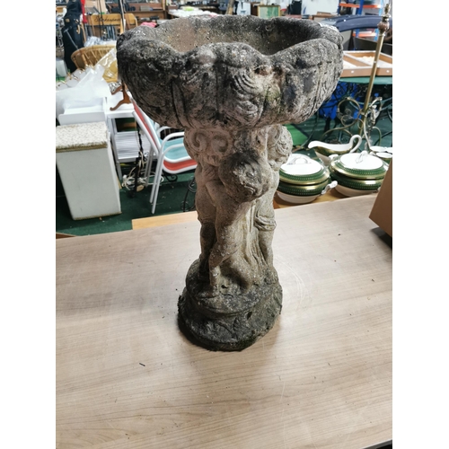 54 - 3 Cherub formed concrete bird bath with good patina. Height of 56cm x 32cm diameter