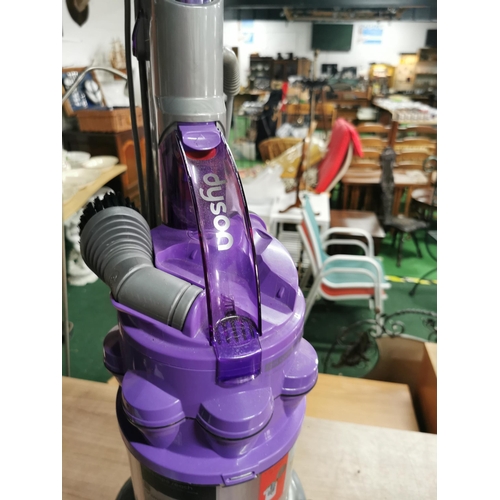 57 - Dyson Animal DC 14 Purple vacuum cleaner with a number of attachments