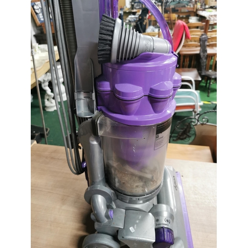 57 - Dyson Animal DC 14 Purple vacuum cleaner with a number of attachments