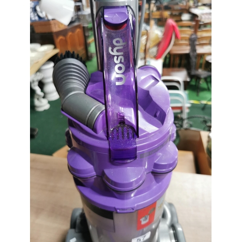 57 - Dyson Animal DC 14 Purple vacuum cleaner with a number of attachments