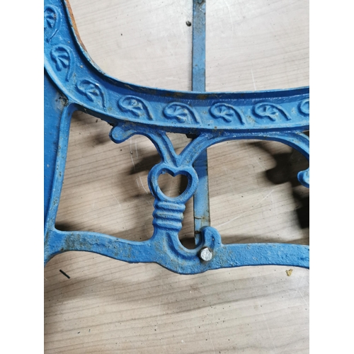 59 - Pair of blue cast iron bench ends with a heart decoration to the center panel. Height of 74cm