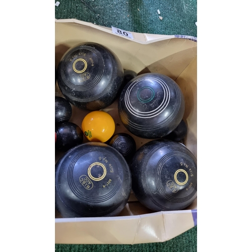 80 - large qty of lawn bowls along with a cased set of Crown Green bowls by PK, also includes a carpet bo... 