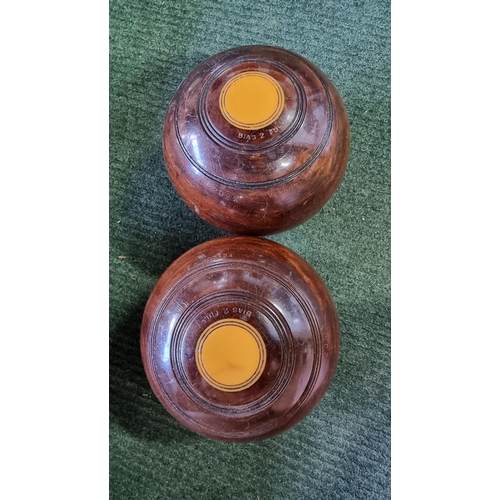 80 - large qty of lawn bowls along with a cased set of Crown Green bowls by PK, also includes a carpet bo... 