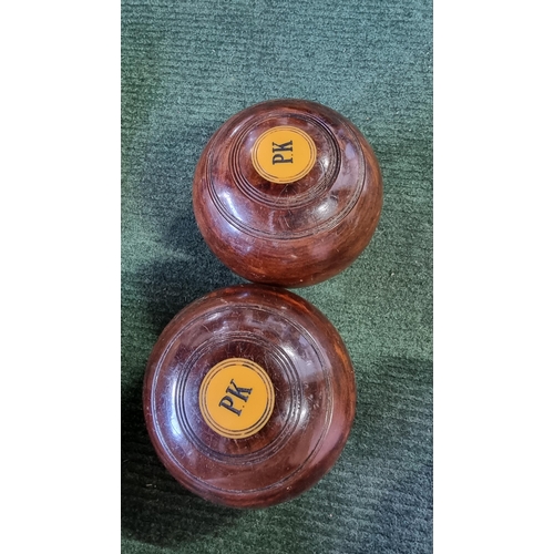 80 - large qty of lawn bowls along with a cased set of Crown Green bowls by PK, also includes a carpet bo... 