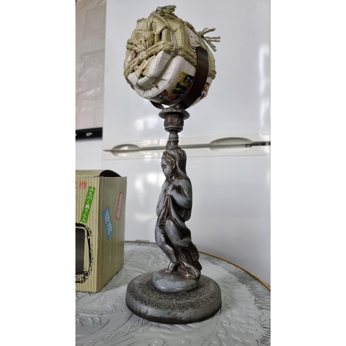 96 - Spelter metal cherub figure holding sealed bottle of Japanese alcohol complete with original box. He... 