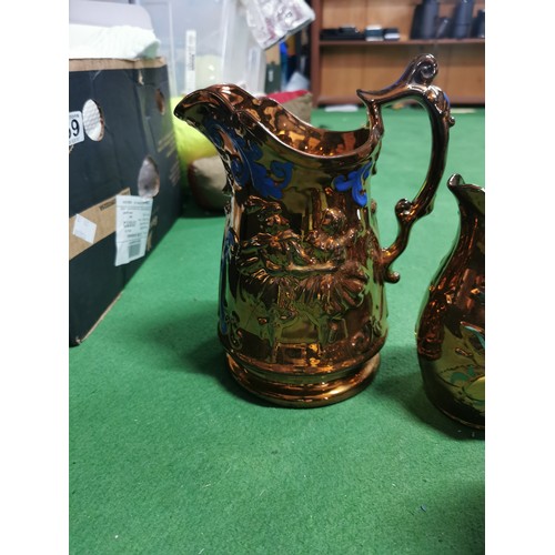 157 - Quantity of 9x copper lustre ware jugs, 6 have handpainted floral design with a Lozenge shaped date ... 