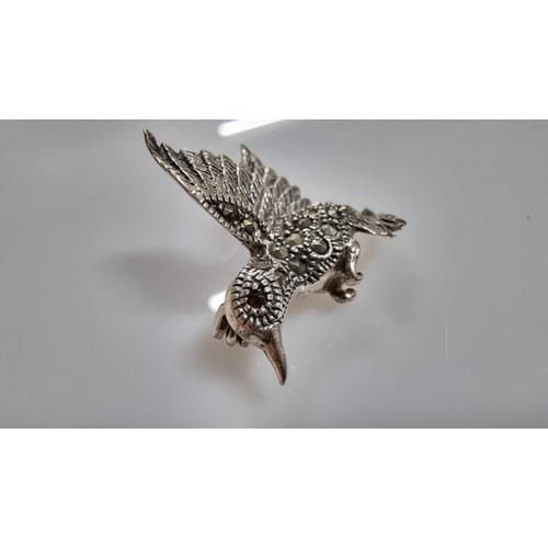 241 - Good quality 925 silver bird formed brooch inset with Marcasite stones & red Garnet stones to the ey... 