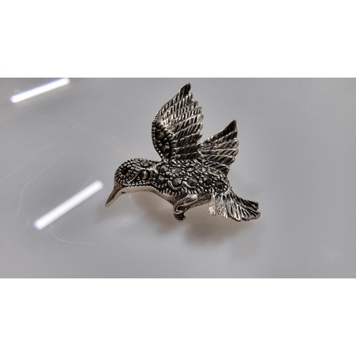 241 - Good quality 925 silver bird formed brooch inset with Marcasite stones & red Garnet stones to the ey... 