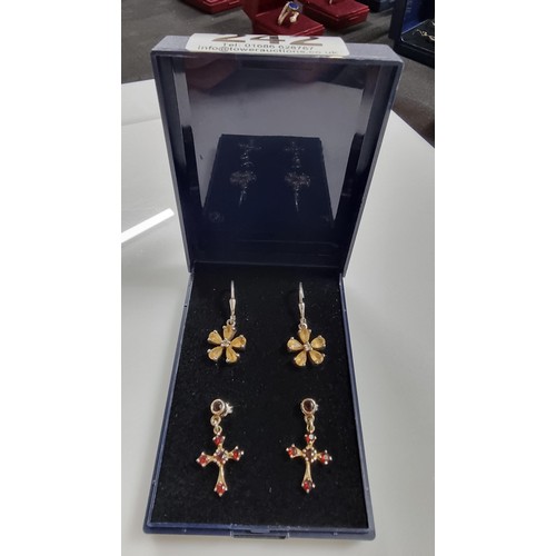 242 - Two pairs of 925 Silver drop earrings inc. a pair of Crucifix earrings with red garnet stones & pair... 