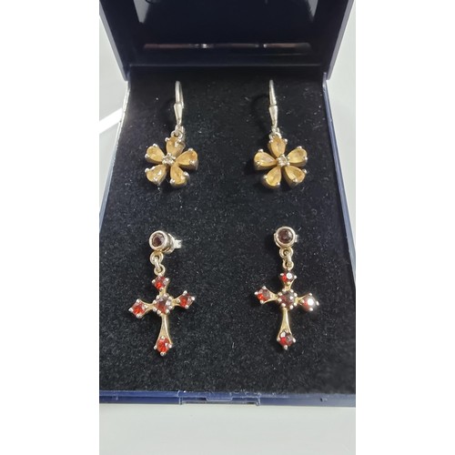 242 - Two pairs of 925 Silver drop earrings inc. a pair of Crucifix earrings with red garnet stones & pair... 