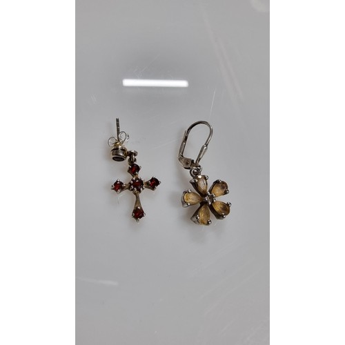 242 - Two pairs of 925 Silver drop earrings inc. a pair of Crucifix earrings with red garnet stones & pair... 