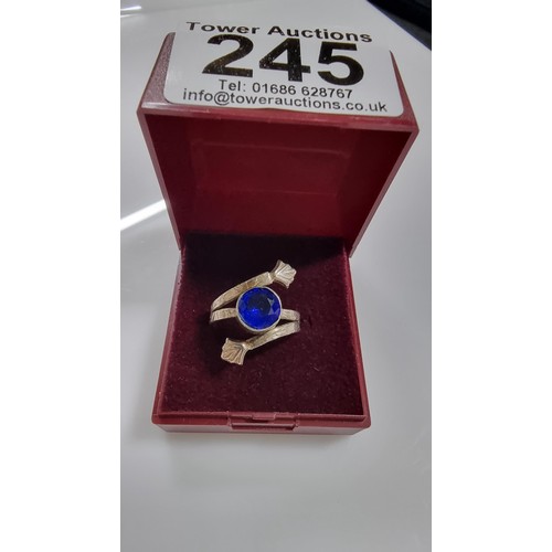 245 - Pretty 925 silver dress ring with a large blue glass crystal to the centre. In good clean condition.... 