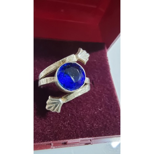 245 - Pretty 925 silver dress ring with a large blue glass crystal to the centre. In good clean condition.... 