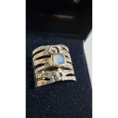 247 - Unusual hand crafted 925 Silver ring with a square rainbow moonstone to the centre with a hand beate... 