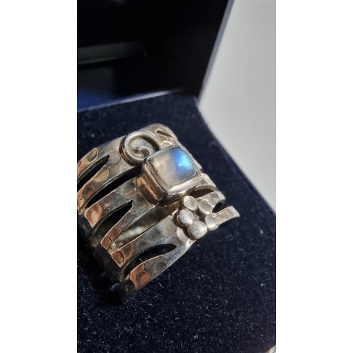 247 - Unusual hand crafted 925 Silver ring with a square rainbow moonstone to the centre with a hand beate... 