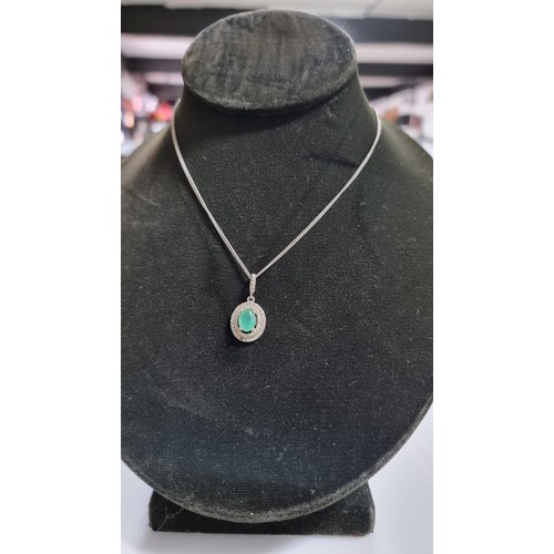 250 - Pretty 925 Silver dress necklace inset with a green glass crystal surround by CZ stones. Complete wi... 