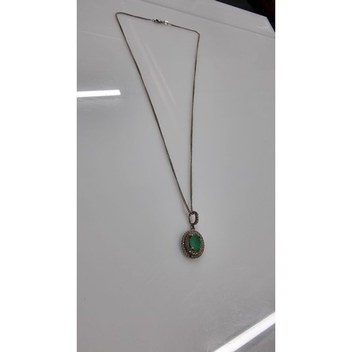 250 - Pretty 925 Silver dress necklace inset with a green glass crystal surround by CZ stones. Complete wi... 