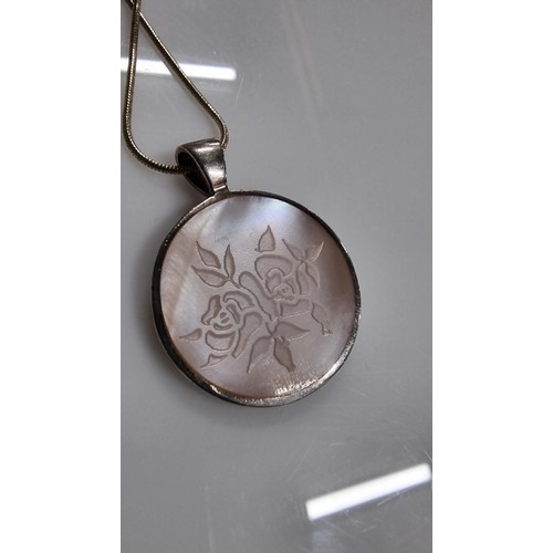 252 - 925 silver double sided pendant inset with MOP on a very long 22