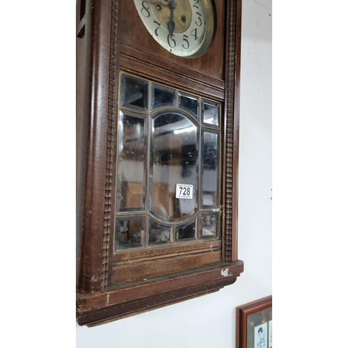 67 - Antique solid oak wall clock with a bevel edged glass door front in good condition striking on a gon... 