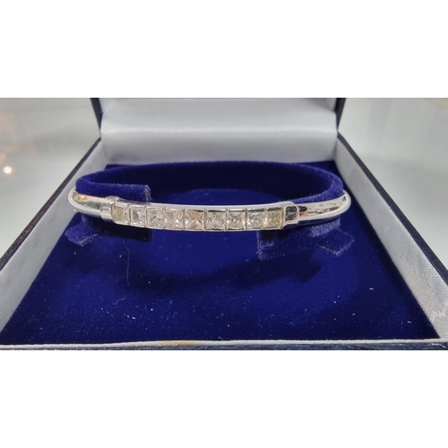 312 - 9ct White Gold bangle inset with a quantity of CZ white crystal stones, in excellent clean condition... 