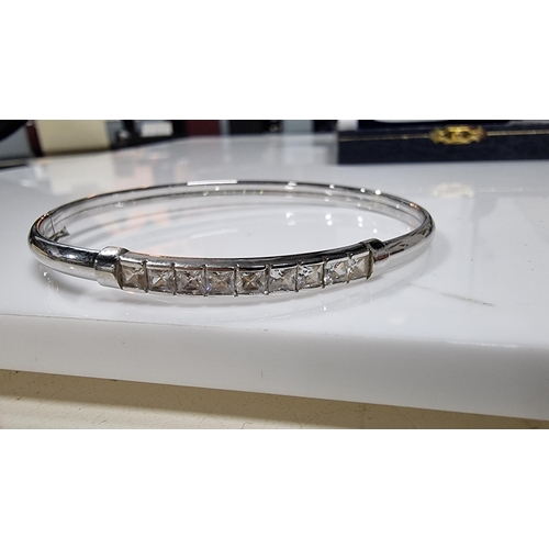 312 - 9ct White Gold bangle inset with a quantity of CZ white crystal stones, in excellent clean condition... 