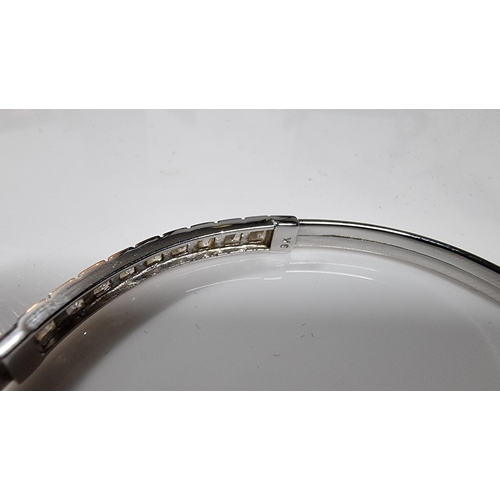 312 - 9ct White Gold bangle inset with a quantity of CZ white crystal stones, in excellent clean condition... 