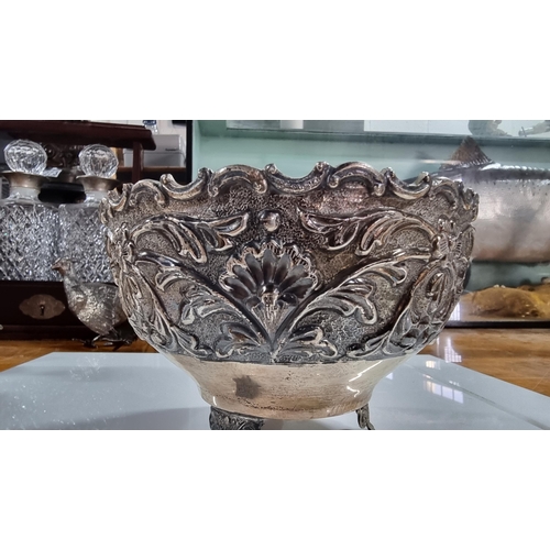 370 - Solid Sterling silver embossed footed bowl with ornate design, super order marked Silver to base and... 