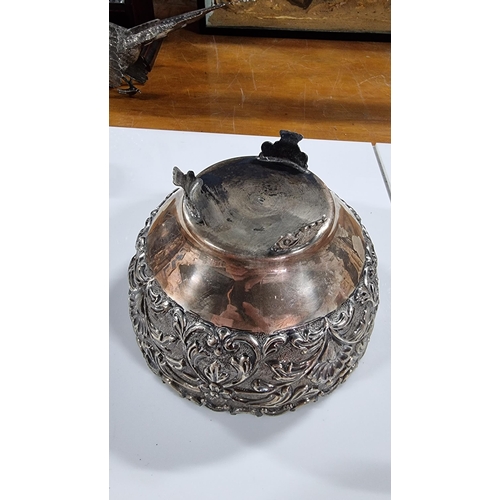 370 - Solid Sterling silver embossed footed bowl with ornate design, super order marked Silver to base and... 