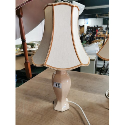 406 - 3x table lamps inc matching pair of peach coloured St. Michael lamps along with a art ceramic lamp. ... 