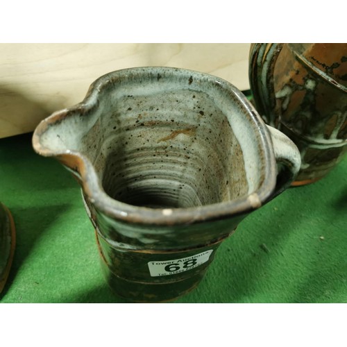 396 - Set of three unusual studio pottery Phil Rogers glazed stoneware graduated jugs with makers mark to ... 