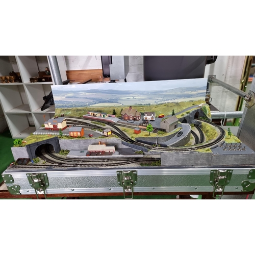 491 - Very well done N gauge train layout diorama, fitted in a good quality metal case presenting excellen... 