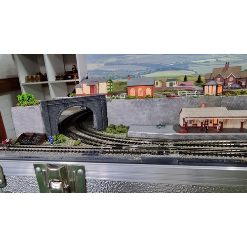 491 - Very well done N gauge train layout diorama, fitted in a good quality metal case presenting excellen... 