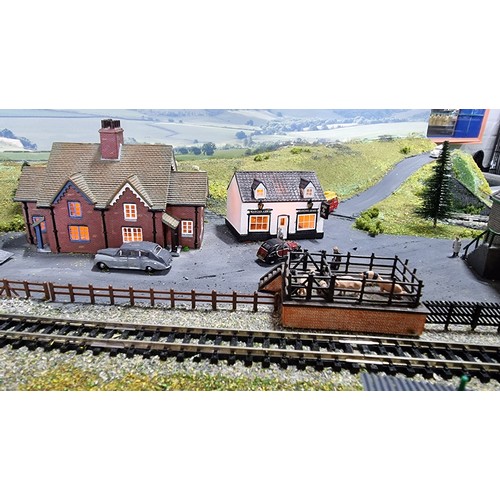 491 - Very well done N gauge train layout diorama, fitted in a good quality metal case presenting excellen... 