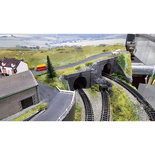 491 - Very well done N gauge train layout diorama, fitted in a good quality metal case presenting excellen... 