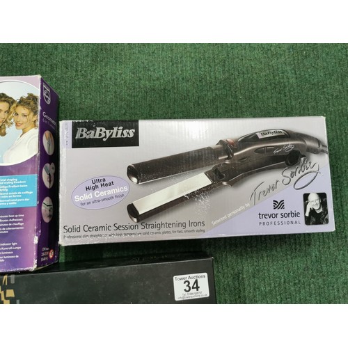 34 - Collection of 3 boxed hair stylers inc babyliss ceramic straightening tongs, GHD IV pro styler etc